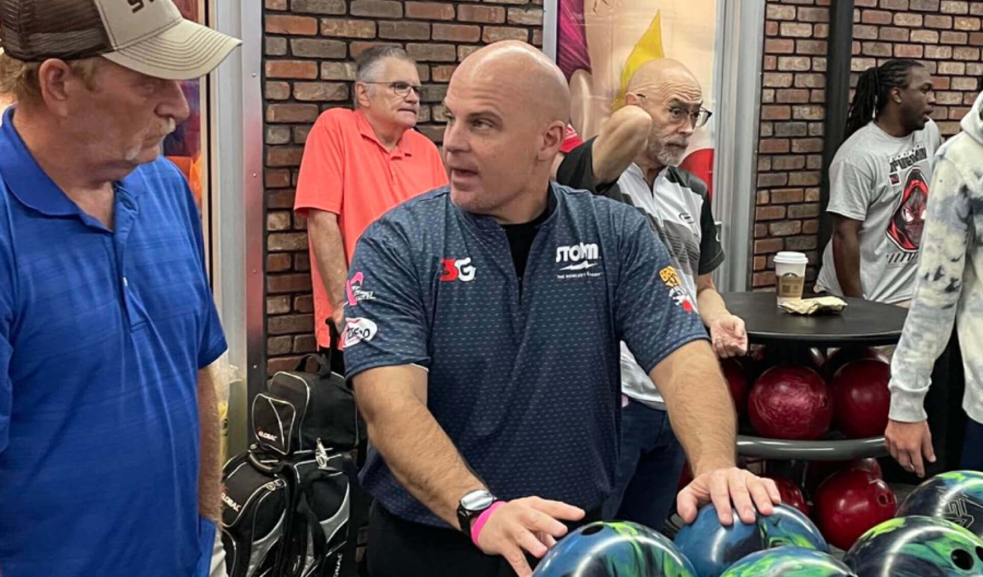 BRETT COOPER HELPS A CUSTOMER AT A MATCHMNAKER EVENT